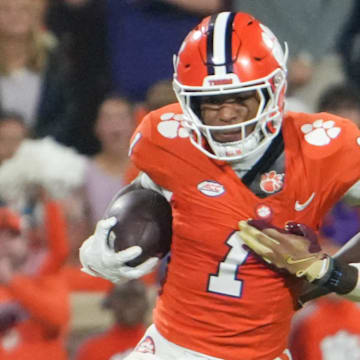 Nov 8, 2025; Clemson, South Carolina, USA; Florida State Seminoles defensive back Ja'Bril Rawls (11) tackles Clemson Tigers wide receiver T.J. Moore (1) during the second quarter at Memorial Stadium. Mandatory Credit: Ken Ruinard - GREENVILLE NEWS-USA TODAY Network via Imagn Images