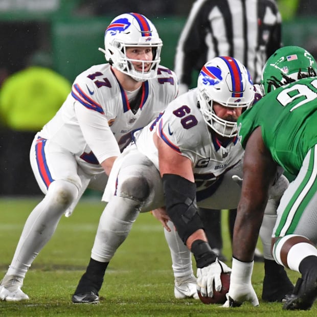 Josh Allen (17) takes the snap from center Mitch Morse (60)