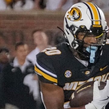 Sep 7, 2024; Columbia, Missouri, USA; Missouri Tigers running back Jamal Roberts (20) runs in for a touchdown against the Buffalo Bulls during the second half at Faurot Field at Memorial Stadium. Mandatory Credit: Denny Medley-Imagn Images