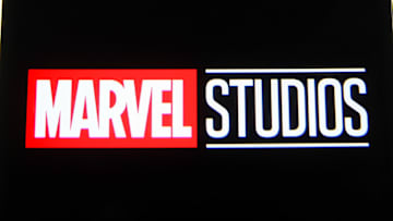In this photo illustration a Marvel Studios logo is seen on...