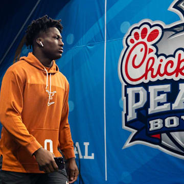 Texas Longhorns linebacker Anthony Hill Jr. (0) walks onto the field as the Texas Longhorns prepare to play the Arizona State Sun Devils in the Peach Bowl College Football Playoff quarterfinal at Mercedes-Benz Stadium in Atlanta, Georgia, Jan. 1, 2025.