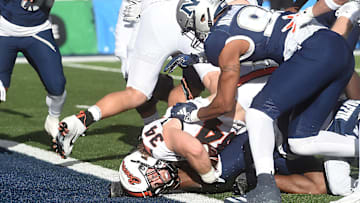 Oregon State’s Jake Reichle scores a touchdown while taking on Nevada at Mackay Stadium in Reno on Oct. 12, 2024.