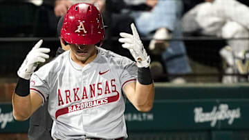 Arkansas catcher Ryder Helfrick (27) celebrates his triple against Vanderbilt during the third inning at Hawkins Field in Nashville, Tenn., Friday, March 28, 2025.