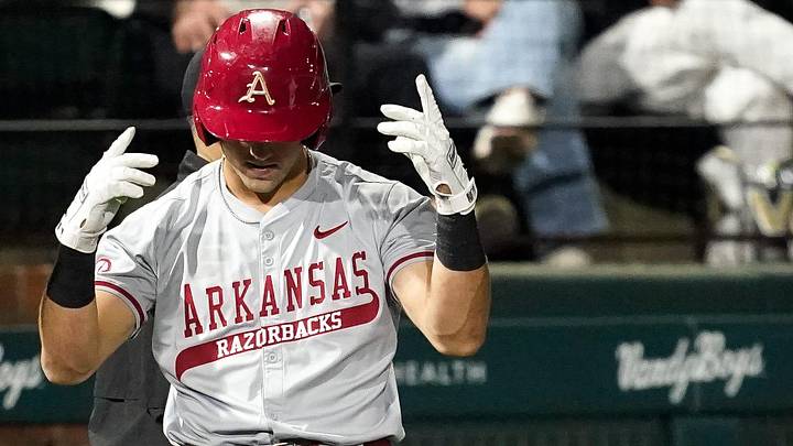Arkansas catcher Ryder Helfrick (27) celebrates his triple against Vanderbilt during the third inning at Hawkins Field in Nashville, Tenn., Friday, March 28, 2025.