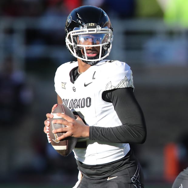 Nov 9, 2024; Lubbock, Texas, USA; Colorado's Shedeur Sanders drops back to pass against Texas Tech.