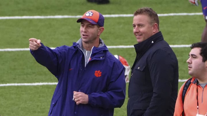 Jan 5, 2019; San Jose, CA, USA; Clemson Tigers head coach Dabo Swinney (left) talks with ESPN broadcaster Kirk Herbstreit (right) during practice prior to the CFP National Championship against the Alabama Crimson Tide at CEFCU Stadium.  