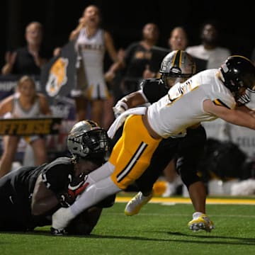 Neville quarterback Parker Robinson helped the Tigers defeat No. 1 Calvary Baptist on Sept. 13, 2024.