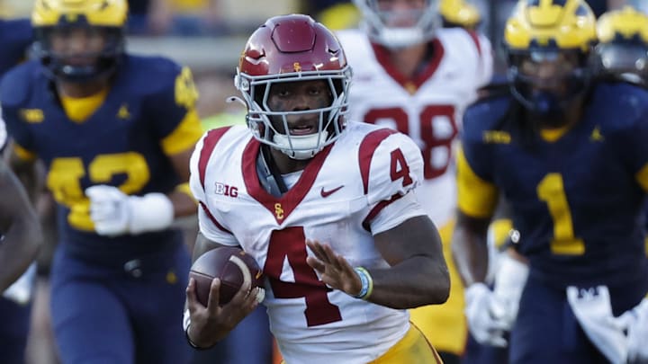 Sep 21, 2024; Ann Arbor, Michigan, USA; USC Trojans running back Woody Marks (4) rushes against the Michigan Wolverines at Michigan Stadium. Mandatory Credit: Rick Osentoski-Imagn Images Sep 21, 2024; Ann Arbor, Michigan, USA; USC Trojans running back Woody Marks (4) rushes against the Michigan Wolverines at Michigan Stadium. Mandatory Credit: Rick Osentoski-Imagn Images