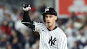 Oct 2, 2025; Bronx, New York, USA; New York Yankees outfielder Cody Bellinger (35) reacts at second base after hitting a double in the fourth inning against the Boston Red Sox during game three of the Wildcard round for the 2025 MLB playoffs at Yankee Stadium. Mandatory Credit: Vincent Carchietta-Imagn Images
