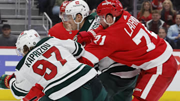 Mar 10, 2022; Detroit, Michigan, USA;  Minnesota Wild left wing Kirill Kaprizov (97)ref10 scores a goal on Detroit Red Wings goaltender Alex Nedeljkovic (39) in the third period at Little Caesars Arena. Mandatory Credit: Rick Osentoski-Imagn Images