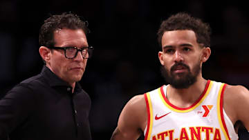 Atlanta Hawks head coach Quin Snyder and Trae Young #11 talk against the Brooklyn Nets.