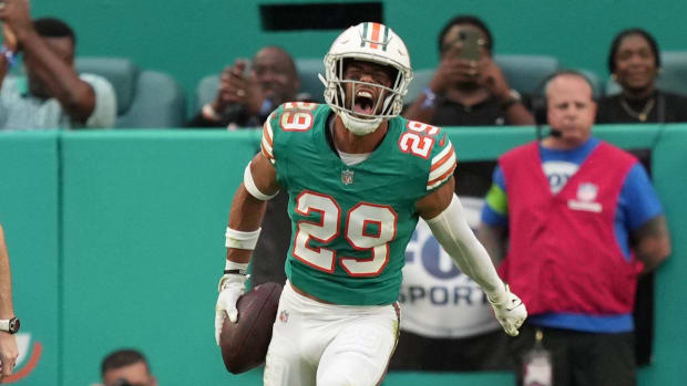 Miami Dolphins safety Brandon Jones (29) celebrates recovering a fumble on the goal line during the first half of an NFL game