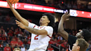 Dec 21, 2024; Newark, New Jersey, USA; Rutgers Scarlet Knights guard Dylan Harper (2) shoots the ball while being defended by Princeton Tigers guard Dalen Davis (22) and guard Blake Peters (24) during the first half  at Prudential Center. Mandatory Credit: Tom Horak-Imagn Images