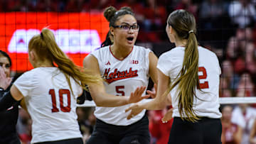 Rebekah Allick (5) celebrates a kill with Bergen Reilly (2). 