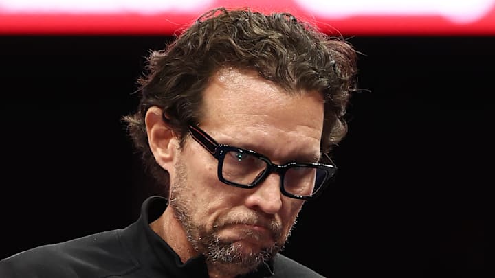 Quin Snyder grimly looks to the floor