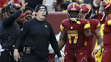 Sep 21, 2025; Landover, Maryland, USA; Washington Commanders head coach Dan Quinn (L) stands with Commanders wide receiver Terry McLaurin (17) on the sidelines against the Las Vegas Raiders during the third quarter at Northwest Stadium. Mandatory Credit: Geoff Burke-Imagn Images