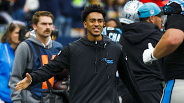 Sep 24, 2023; Seattle, Washington, USA; Carolina Panthers quarterback Bryce Young (9) greets a teammate on the sideline following a touchdown against the Seattle Seahawks during the second quarter at Lumen Field. 