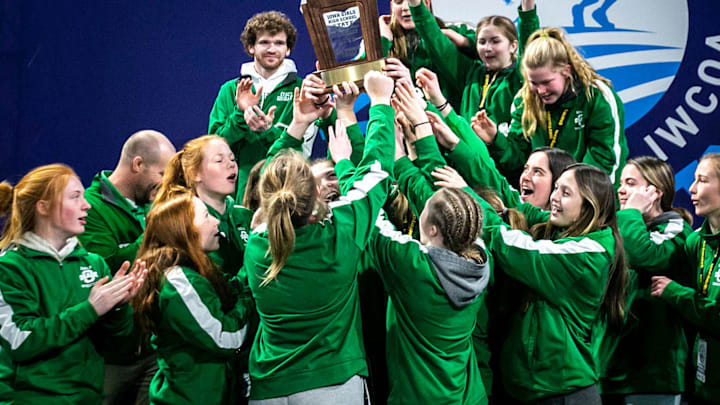 Osage wrestlers celebrate with their third place team trophy in the finals during of the Iowa Wrestling Coaches and Officials Association (IWCOA) girls' state wrestling tournament, Saturday, Jan. 22, 2022, at the Xtream Arena in Coralville, Iowa.

220121 Girls Iwcoa State Finals Wr 048 Jpg