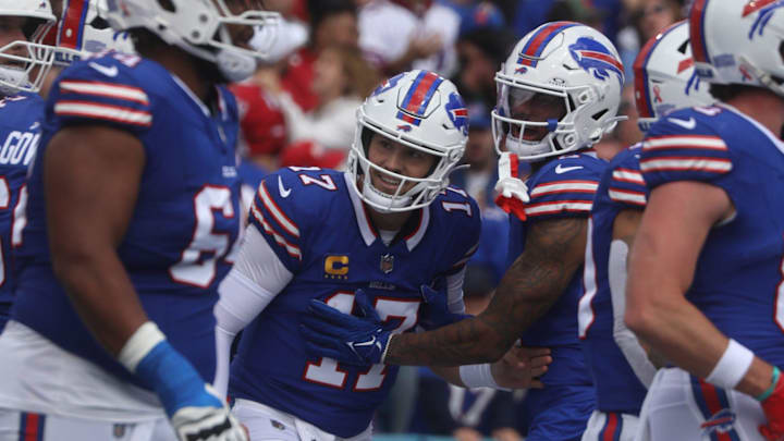 Bills quarterback Josh Allen and teammates celebrate what they thought was his touchdown run until the officials waved it off and called a Bills penalty during first half action at Highmark Stadium.