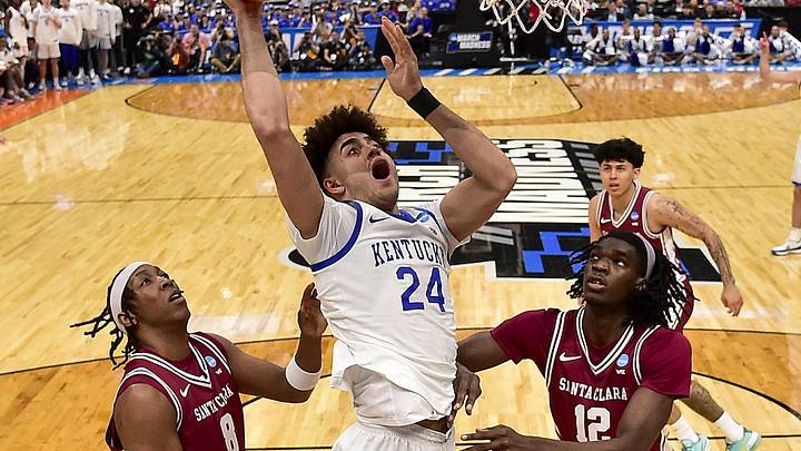 Mar 20, 2026; St. Louis, MO, USA; Kentucky Wildcats center Malachi Moreno (24) goes for a lay up as Santa Clara Broncos forward Elijah Mahi (8) guard Jake Ensminger (44) and center Bukky Oboye (12) defend during the first half during in first round game of the men's 2026 NCAA Tournament at Enterprise Center. Mandatory Credit: Jeff Curry-Imagn Images