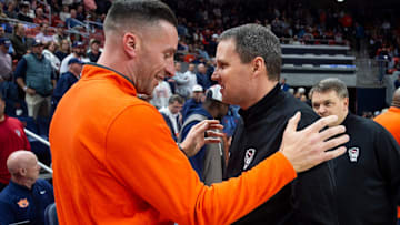 Auburn Tigers head coach Steven Pearl and NC State Wolfpack head coach Will Wade talk as the Auburn Tigers take on the NC State Wolfpack at Neville Arena in Auburn, Ala. on Wednesday, Dec. 3, 2025.