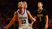 Albany boys basketball senior Ethan Meyer blocks out a Caledonia player in the state semifinal game March 21, 2025 at Williams Arena in Minneapolis. The Huskies won 59-54.