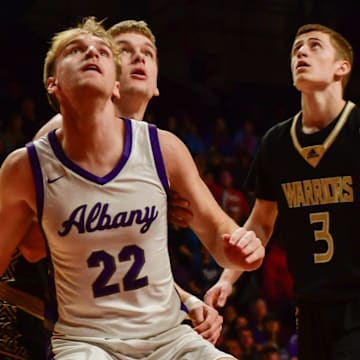 Albany boys basketball senior Ethan Meyer blocks out a Caledonia player in the state semifinal game March 21, 2025 at Williams Arena in Minneapolis. The Huskies won 59-54.