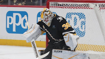 Feb 4, 2025; Pittsburgh, Pennsylvania, USA;  Pittsburgh Penguins goaltender Alex Nedeljkovic (39) makes a save against the New Jersey Devils during the second period at PPG Paints Arena. Mandatory Credit: Charles LeClaire-Imagn Images