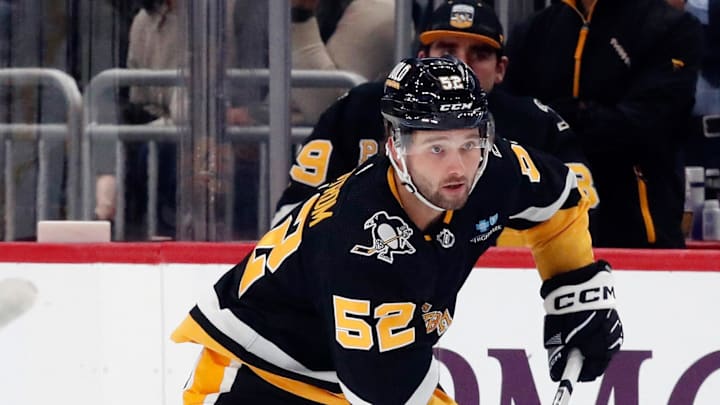Mar 7, 2024; Pittsburgh, Pennsylvania, USA;  Pittsburgh Penguins right wing Emil Bemstrom (52) skates with the puck against the Washington Capitals during the first period at PPG Paints Arena. Mandatory Credit: Charles LeClaire-Imagn Images