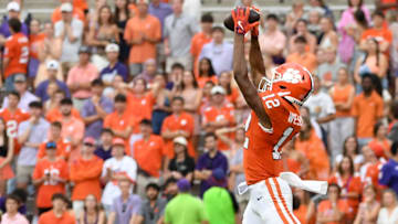 Clemson Tigers wide receiver Bryant Wesco Jr. (12) catches a pass while being defended by Troy Trojans safety David Daniel-Sisavanh (14) Saturday, Sept. 6, 2025 during the NCAA football game at Memorial Stadium in Clemson, South Carolina.