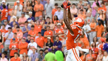 Clemson Tigers wide receiver Bryant Wesco Jr. (12) catches a pass while being defended by Troy Trojans tight end Ethan Conner (14) Saturday, Sept. 6, 2025 during the NCAA football game at Memorial Stadium in Clemson, South Carolina.