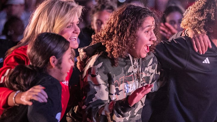 Monterey's Aaliyah Chavez (center) swag surfs with Krista Gerlich and the Lady Raiders during the Texas Tech basketball block party, Monday, October 28, 2024, on Broadway.