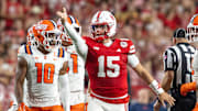 Nebraska quarterback Dylan Raiola signals a first down against Illinois last season.
