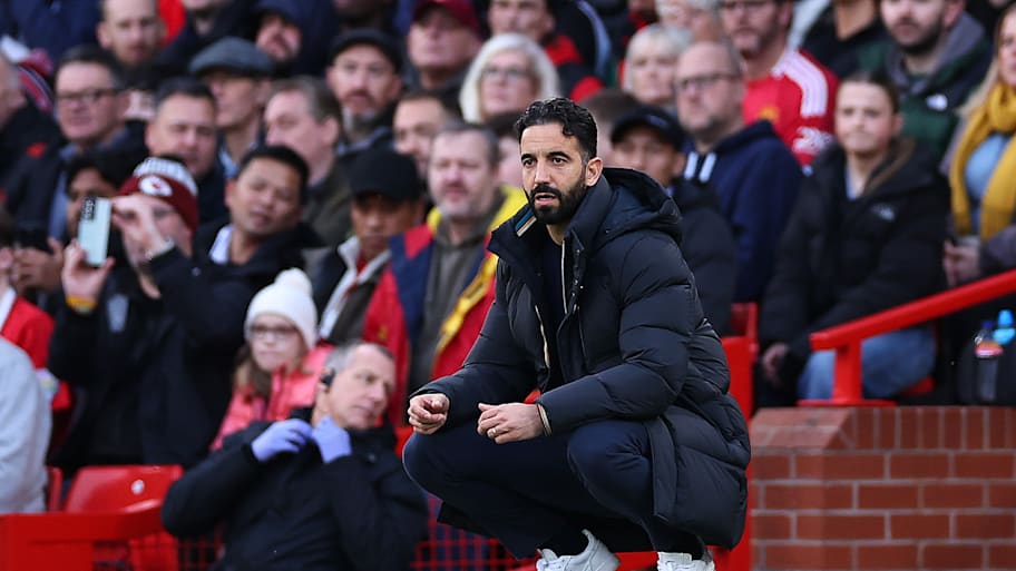 Ruben Amorim crouching.