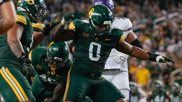 Aug 31, 2024; Waco, Texas, USA;  Baylor Bears defensive lineman Jackie Marshall (0) celebrates after making a sack against the Tarleton State Texans during the second half at McLane Stadium. Mandatory Credit: Chris Jones-Imagn Images