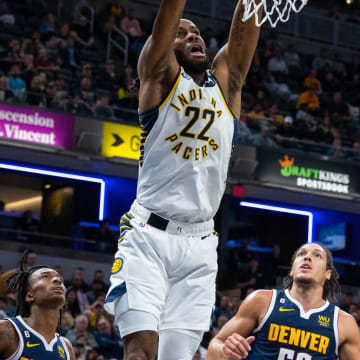 Nov 9, 2022; Indianapolis, Indiana, USA; Indiana Pacers forward Isaiah Jackson (22) shoots the ball while Denver Nuggets forward Aaron Gordon (50) defends in the second quarter at Gainbridge Fieldhouse. Mandatory Credit: Trevor Ruszkowski-USA TODAY Sports