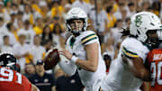 Nov 15, 2025; Waco, Texas, USA;  Baylor Bears quarterback Sawyer Robertson (13) looks to pass against the Utah Utes during the first half at McLane Stadium. Mandatory Credit: Chris Jones-Imagn Images