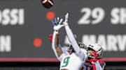 South Florida Bulls defensive back Aamaris Brown (9) intercepts the ball intended for Cincinnati Bearcats wide receiver Tyler Scott (21) in the first half at Nippert Stadium. Mandatory Credit: Katie Stratman-Imagn Images