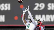 Oct 8, 2022; Cincinnati, Ohio, USA; South Florida Bulls defensive back Aamaris Brown (9) intercepts the ball intended for Cincinnati Bearcats wide receiver Tyler Scott (21) in the first half at Nippert Stadium. Mandatory Credit: Katie Stratman-Imagn Images