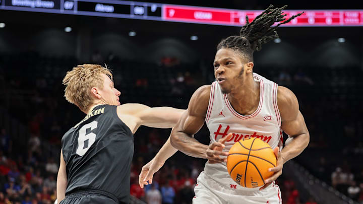 Houston's Joseph Tugler (right)