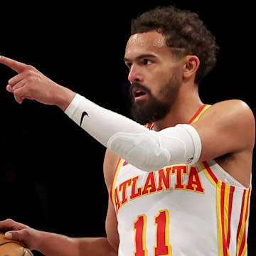 Apr 10, 2025; Brooklyn, New York, USA; Atlanta Hawks guard Trae Young (11) controls the ball against the Brooklyn Nets during the third quarter at Barclays Center. Mandatory Credit: Brad Penner-Imagn Images