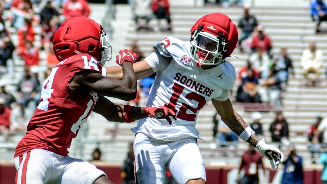 Oklahoma defensive back Derrick Johnson II defends a pass intended for wide receiver Elijah Thomas in the spring game.