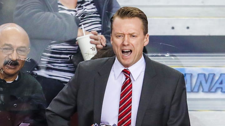 Mar 31, 2018; Calgary, Alberta, CAN; Calgary Flames head coach Glen Gulutzan on his bench against the Edmonton Oilers during the third period at Scotiabank Saddledome. Calgary Flames won 3-2. Mandatory Credit: Sergei Belski-Imagn Images