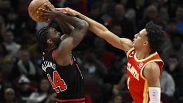 Patrick Williams #44 of the Chicago Bulls goes up against Jalen Johnson #1 of the Atlanta Hawks.