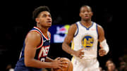 Nov 16, 2021; Brooklyn, New York, USA; Brooklyn Nets guard Cam Thomas (24) pulls up for a shot against Golden State Warriors forward Jonathan Kuminga (00) during the fourth quarter at Barclays Center. Mandatory Credit: Brad Penner-Imagn Images
