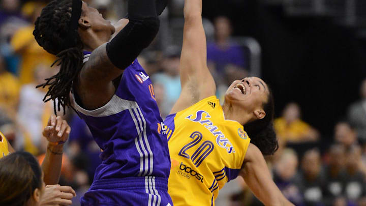 Sep 23, 2013; Los Angeles, CA, USA;  Los Angeles Sparks guard Lindsey Harding (20) and Phoenix Mercury forward Lynetta Kizer (12) go for a rebound in the second half of game three of the Western Conference Semi-Finals at the Staples Center. Phoenix won 78-77.  Mandatory Credit: Jayne Kamin-Oncea-Imagn Images