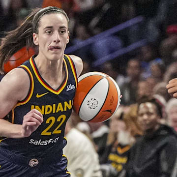 May 10, 2025; Atlanta, GA, USA; Indiana Fever guard Caitlin Clark (22) dribbles against Atlanta Dream guard Te-Hina Paopao (2) during the second half at Gateway Center Arena @ College Park. Mandatory Credit: Dale Zanine-Imagn Images