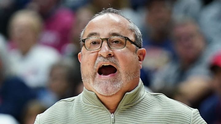 South Florida Bulls head coach Jose Fernandez watches from the sideline as they take on the UConn Huskies. South Florida Bulls head coach Jose Fernandez watches from the sideline as they take on the UConn Huskies.