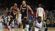 Houston players J'Wan Roberts (13) and Emanuel Sharp (21) celebrate after the Cougars' 70-67 come-from-behind win against Duke in the Final Four on April 5, 2025.