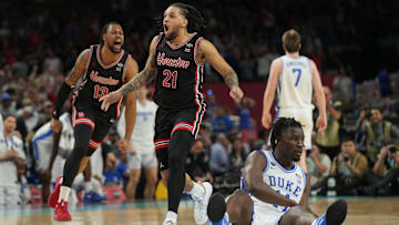 Houston players J'Wan Roberts (13) and Emanuel Sharp (21) celebrate after the Cougars' 70-67 come-from-behind win against Duke in the Final Four on April 5, 2025.